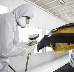 Collision Center Technician Painting a Vehicle | Group 1 Toyota Stone Mountain in Lilburn GA